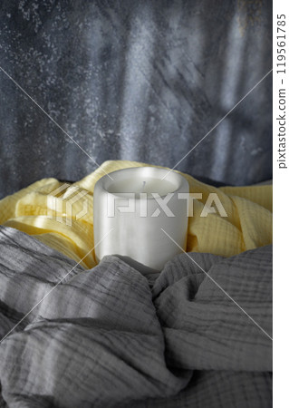 Homemade white ceramic candles on grey background Homemade white ceramic candles on grey background 119561785