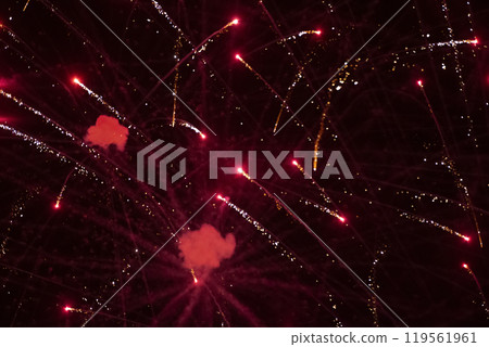 Red rays of fireworks on black background. Festive night background. Red rays of fireworks on black background. Festive night background. 119561961