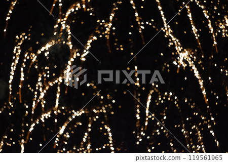 Golden rays of fireworks on black background. Festive night background. Golden rays of fireworks on black background. Festive night background. 119561965