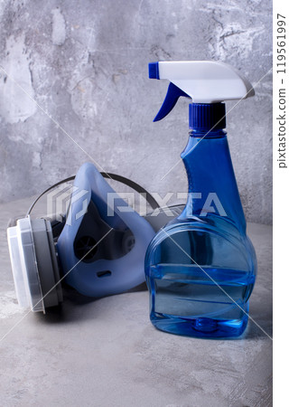 Respirator and spray bottle with hand sanitizer to prevent the spread of coronavirus. 119561997