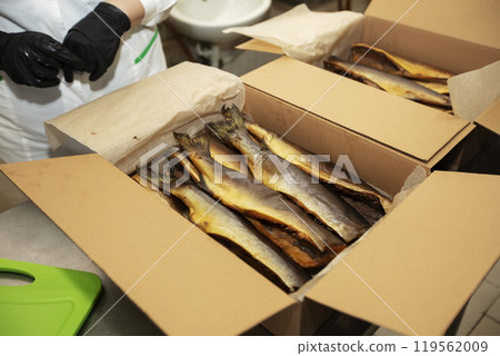 Smoked mackerel in a paper box. Fishing industry. 119562009