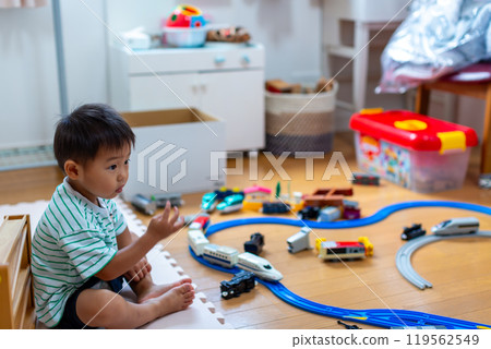 A 2-year-old boy playing with Plarail 119562549