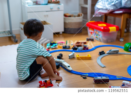 A 2-year-old boy playing with Plarail 119562551