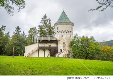 Slikovka Tower stands proudly in the Ore Mountains, surrounded by lush greenery. Once part of Slik Castle, its historic charm attracts visitors year-round in Jachymov. Slikovka Tower stands proudly in the Ore Mountains, surrounded by lush greenery. Once part of Slik Castle, its historic charm attracts visitors year-round in Jachymov. 119562677