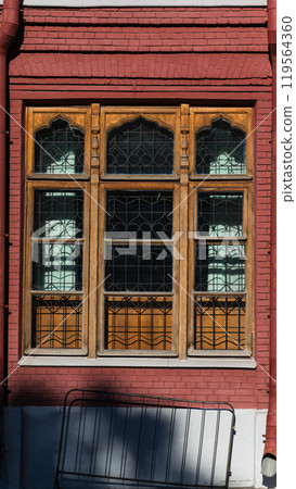 A large, wooden, old window of an old, red-brick building in Moscow A large, wooden, old window of an old, red-brick building in Moscow 119564360