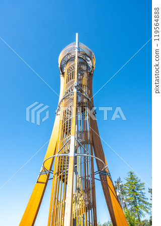 The Hamstejn lookout tower features a steel structure with a spiral staircase, offering stunning views of the Bohemian Paradise landscape on a clear day. Visitors can climb and enjoy the scenery. 119564888