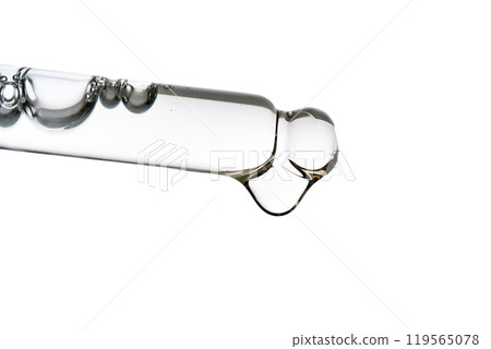 Dropper pipette with delicious serum with bubbles close-up. Dropper pipette with delicious serum with bubbles close-up. 119565078