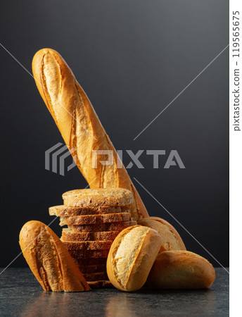 Bread on a black stone table. 119565675