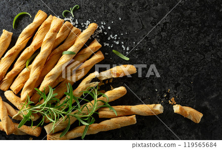 Homemade grissini breadsticks with sea salt and rosemary. Homemade grissini breadsticks with sea salt and rosemary. 119565684