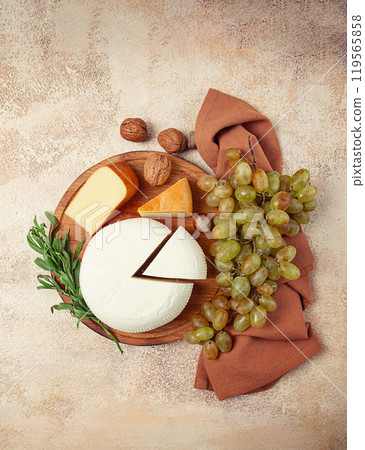 Georgian cheese, Imeretian and smoked suluguni, grapes, nuts, on a cutting board, Georgian cuisine, no people, 119565858
