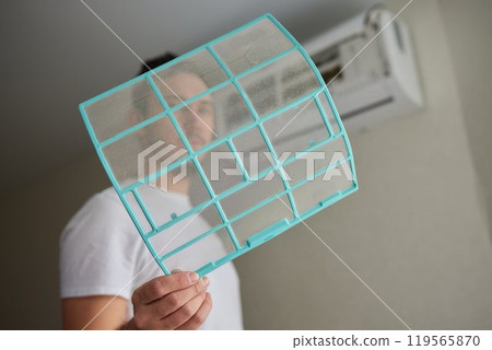 Dirty air conditioner filter need cleaning. Air conditioner service, repair and clean equipment. Dirty air conditioner filter need cleaning. Air conditioner service, repair and clean equipment. 119565870