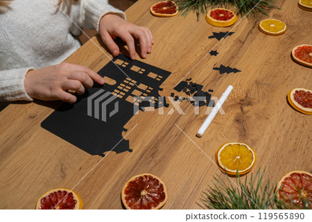 Gingerbread paper house handmade Storytelling creating craft Christmas holiday decoration. Tactile hand-on activity. Master class progress of creative me-made gifts. Seasonal domestic life micro Gingerbread paper house handmade Storytelling creating craft Christmas holiday decoration. Tactile hand-on activity. Master class progress of creative me-made gifts. Seasonal domestic life micro 119565890