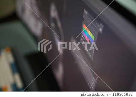 Designer Editing Photo On Computer In Office 119565952