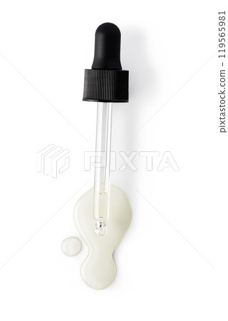 Drop falls from a pipette into a cosmetic bottle 119565981