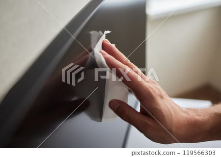 cleaning pc monitor an hand hold a rag cleaning pc monitor an hand hold a rag 119566303