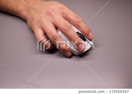 Close-up Macro Shot: Person's Hand Using Wireless Computer Mouse, Scrolls through Apps and Websites with a Wheel and Clicks on Buttons 119566367
