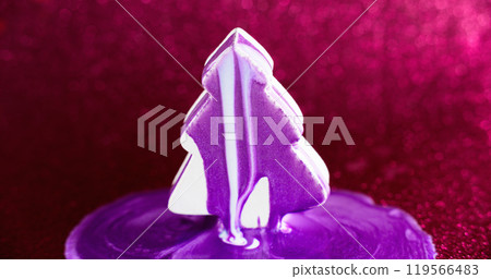 Paint fir tree. Xmas decoration. Purple white color shimmering ink drip spill over abstract conifer shape on defocused pink bokeh light background. 119566483