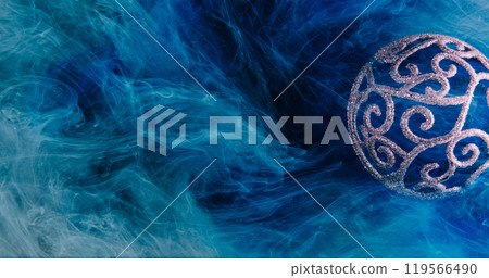 Xmas magic. Mist floating. Shimmering glitter round intricate Christmas bauble blue paint water splash fume cloud texture abstract background. Xmas magic. Mist floating. Shimmering glitter round intricate Christmas bauble blue paint water splash fume cloud texture abstract background. 119566490