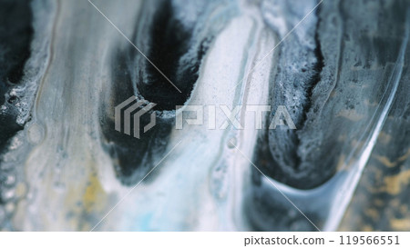 Fluid acryl drip. Glitter ink mix. Defocused white black gray dye oil emulsion shiny particles flow on gold color abstract background. Fluid acryl drip. Glitter ink mix. Defocused white black gray dye oil emulsion shiny particles flow on gold color abstract background. 119566551
