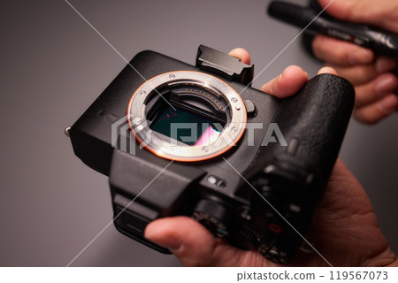 Cleaning the camera sensor with a blower for office equipment and electronics from contamination. Cleaning and care of the camera sensor 119567073