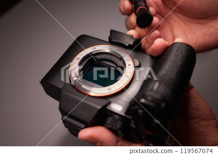 Cleaning the camera sensor with a blower for office equipment and electronics from contamination. Cleaning and care of the camera sensor Cleaning the camera sensor with a blower for office equipment and electronics from contamination. Cleaning and care of the camera sensor 119567074