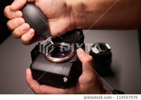 Cleaning the camera sensor with a blower for office equipment and electronics from contamination. Cleaning and care of the camera sensor 119567076