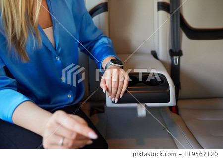 female hand opens the Cup holder in the car female hand opens the Cup holder in the car 119567120