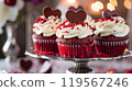 Red Velvet Cupcakes with Cream Cheese Frosting, Red Velvet Crumbs, and Chocolate Heart on a Silver Stand 119567246