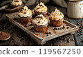 Rustic Wooden Tray with Coffee-Infused Cupcakes and Caramel Buttercream in a Cozy Cafe 119567250