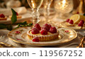 The tartlets are artfully arranged, surrounded by fine dining decor, enhancing their presentation 119567252