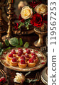 The tartlets are artfully arranged, surrounded by fine dining decor, enhancing their presentation 119567253