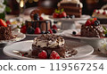 Elegant Restaurant Table with Assorted Chocolate Desserts, Mousses, and Tartlets, Garnished with Shavings and Berries 119567254