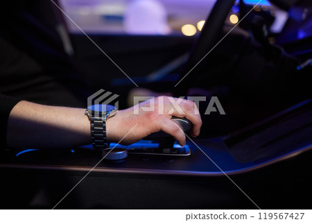 Selector automatic transmission with leather in the interior of a modern expensive car. The background is blurred. Black and brown leather car. 119567427