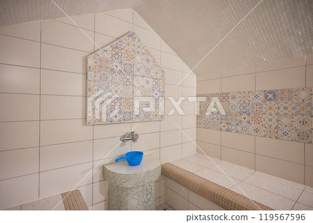 Azure and white textile floor with bench in brick building Azure and white textile floor with bench in brick building 119567596