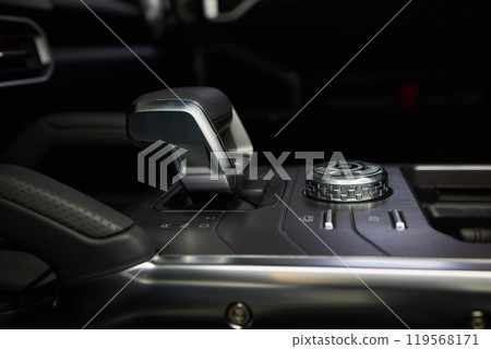a close up of a car dashboard with a remote control a close up of a car dashboard with a remote control 119568171