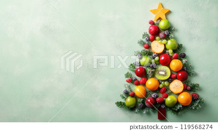 Christmas tree made of broccoli, cherry tomatoes and greens on light green background 119568274