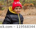 Happy baby portrait wearing warm clothes close up. 119568344