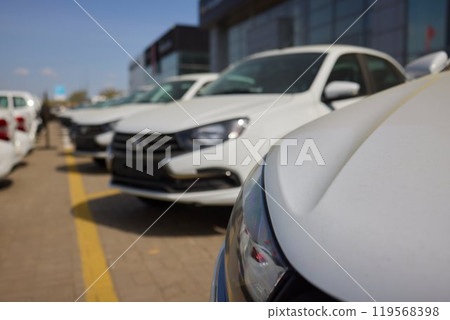 Car Sales and Loan Industry Concept. Row of Brand New Vehicles in Stock. 119568398