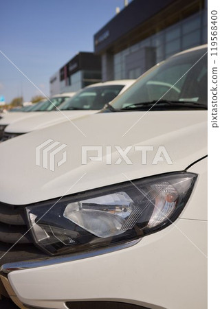 Car Sales and Loan Industry Concept. Row of Brand New Vehicles in Stock. 119568400