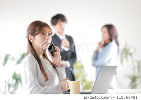 A business person gossiping and a woman talking on the phone with concern_1 119568481