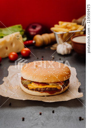 Juicy cheeseburger with melted cheese, pickles, and fresh ingredients, food photography projects Juicy cheeseburger with melted cheese, pickles, and fresh ingredients, food photography projects 119569475