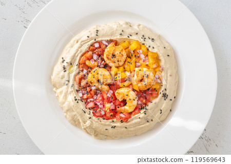 Portion of hummus 119569643