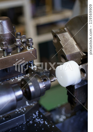Scene of center machining on a lathe 119569909