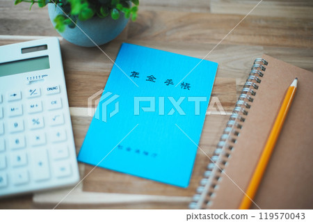 Blue pension book, calculator and writing utensils Blue pension book, calculator and writing utensils 119570043
