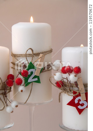 New year and Christmas preparation. Four-week advent candles on table. Handmade eco-friendly decor. Sustainable Christmas decoration 119570672