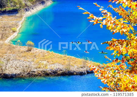 A canoe that goes through Okushima Lake in the autumn colors A canoe that goes through Okushima Lake in the autumn colors 119571385