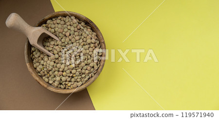 Raw green lentil Gluten free cereals. Health gut benefits. Concept of alternative whole spelt grain ingredient. Vegetarian diet recipes. Plant-based lifestyle. Copy space Protein rich Raw green lentil Gluten free cereals. Health gut benefits. Concept of alternative whole spelt grain ingredient. Vegetarian diet recipes. Plant-based lifestyle. Copy space Protein rich 119571940