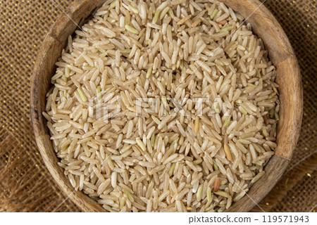 Raw brown rice Gluten free cereals. Health gut benefits. Concept of alternative whole spelt grain ingredient. Vegetarian diet recipes. Plant-based lifestyle. Copy space Protein rich 119571943