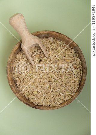 Raw brown rice Gluten free cereals. Health gut benefits. Concept of alternative whole spelt grain ingredient. Vegetarian diet recipes. Plant-based lifestyle. Copy space Protein rich 119571945