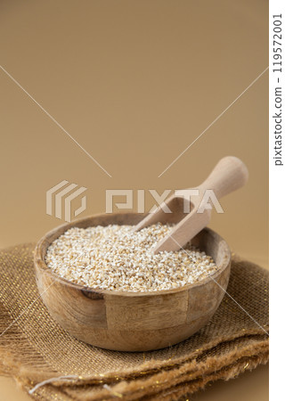 Raw fine ground barley porridge Gluten free cereals. Health gut benefits. Concept of alternative whole spelt grain ingredient. Vegetarian diet recipes. Plant-based lifestyle. Copy space Protein rich 119572001